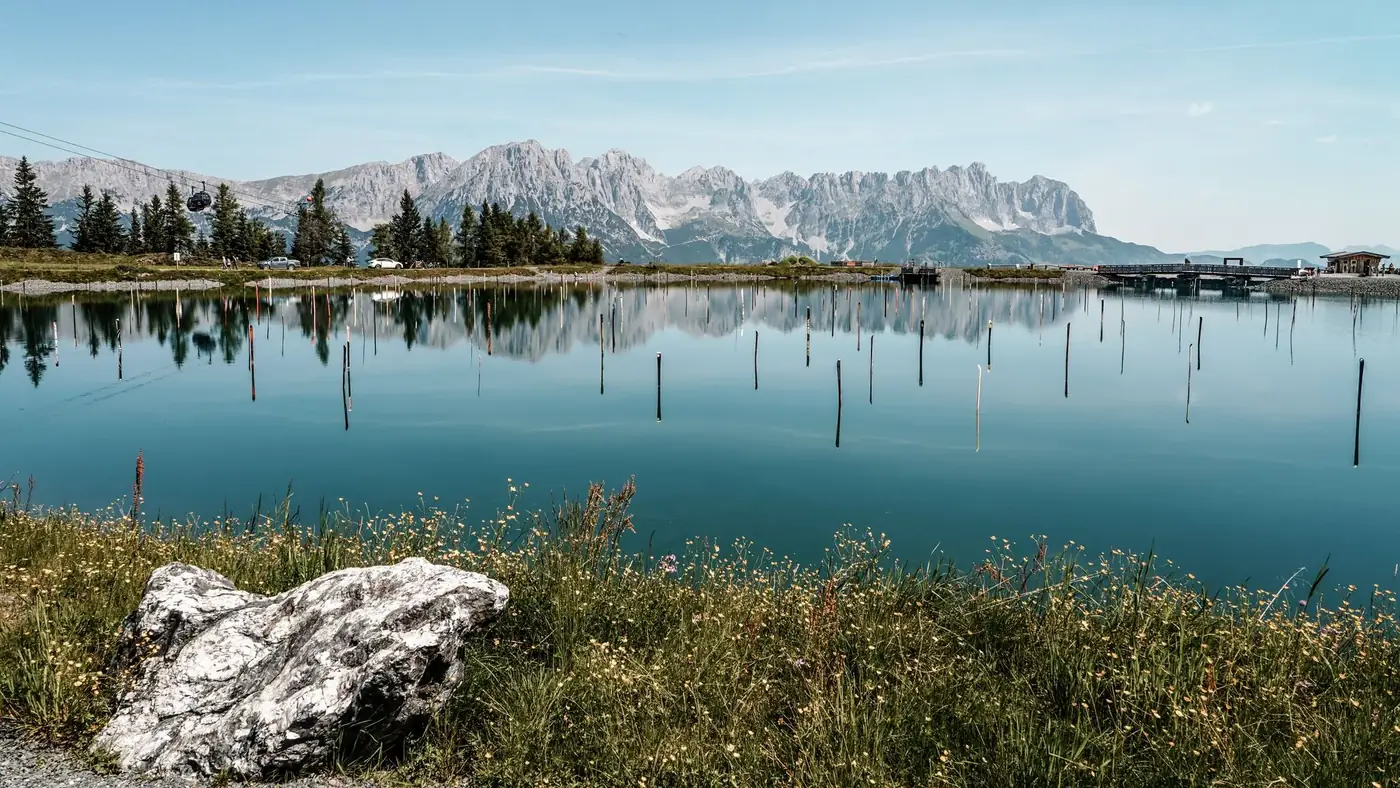 Idyllic view of a tranquil alpine lake with mountain reflections in Ellmau, Tirol, Austria.