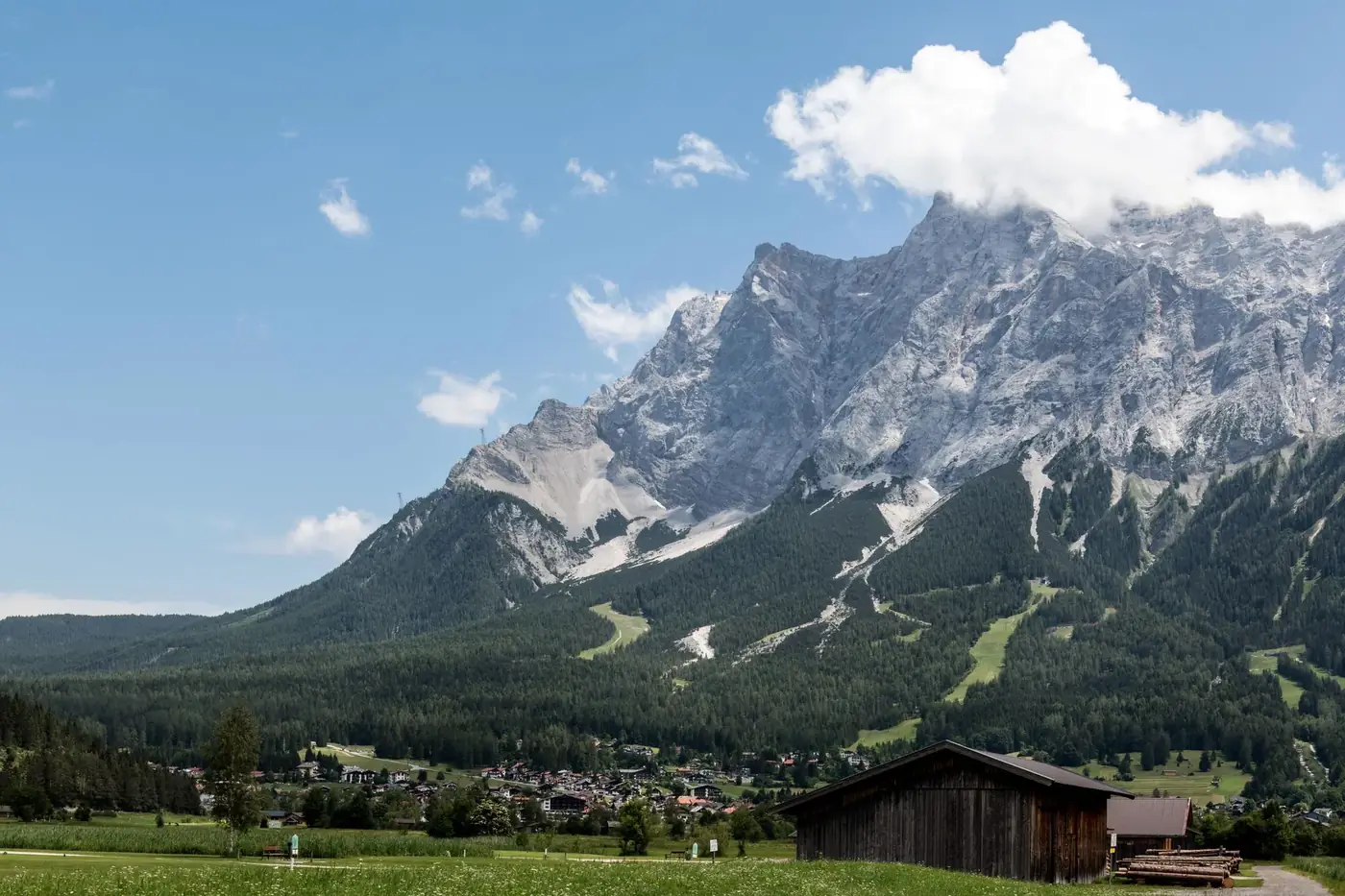 Explore the breathtaking alpine landscape of Lermoos, Austria, featuring majestic mountains and lush greenery.