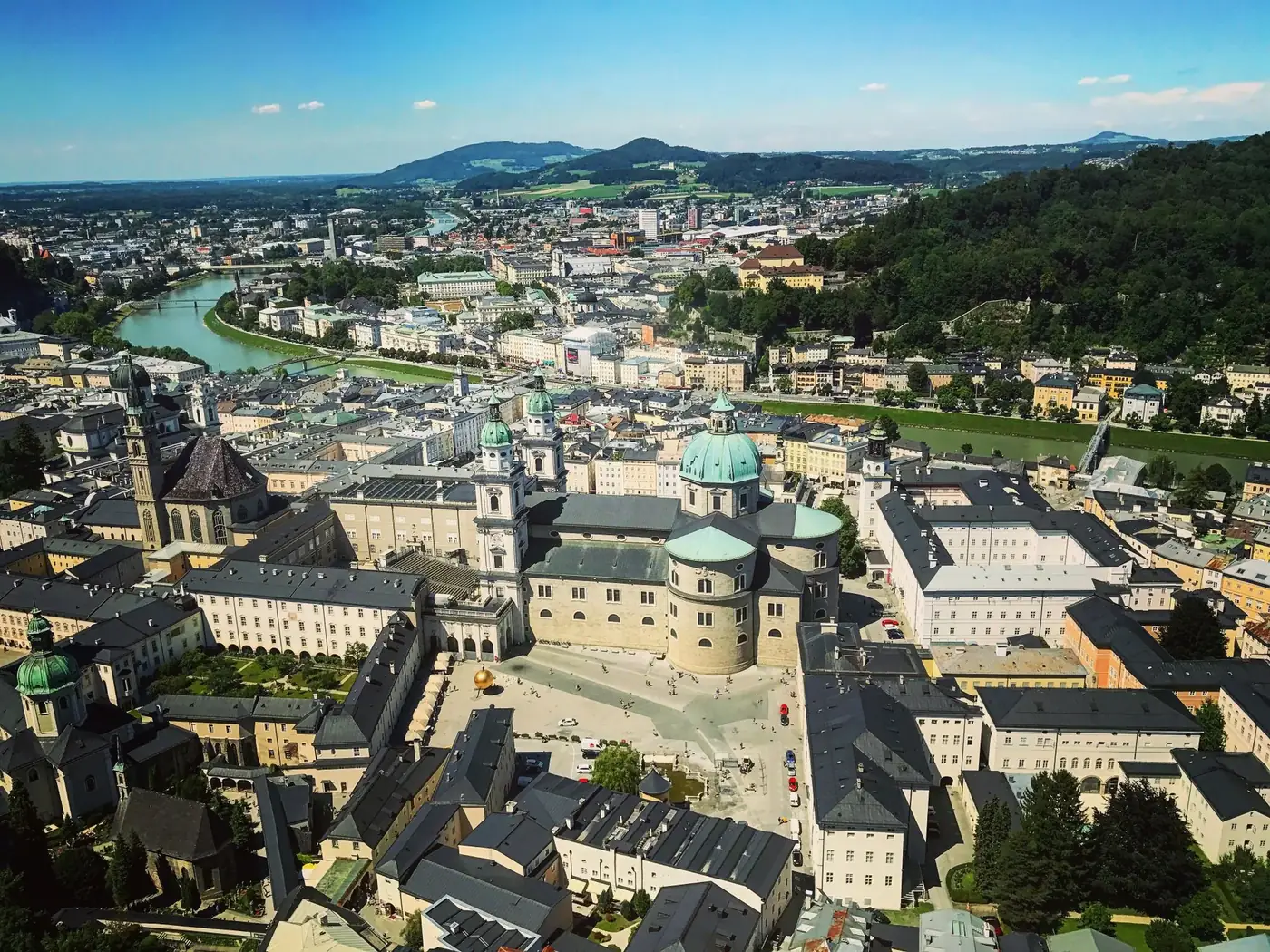 A stunning aerial view of Salzburg, Austria, showcasing its historic architecture and natural beauty.