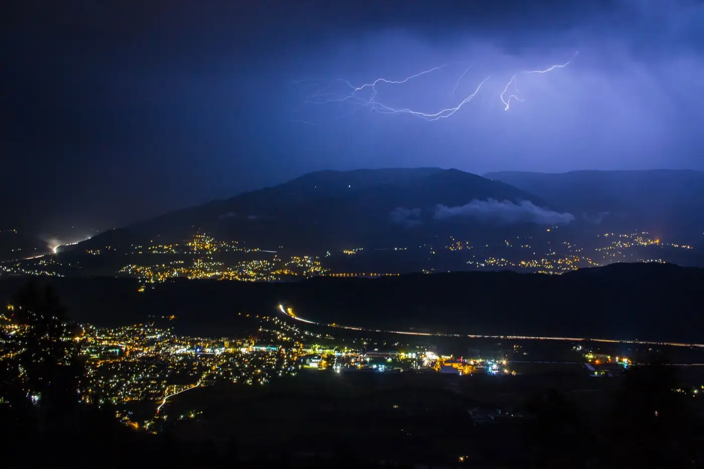 A stunning nighttime view of lightning illuminating the city of Spittal an der Drau, Austria.