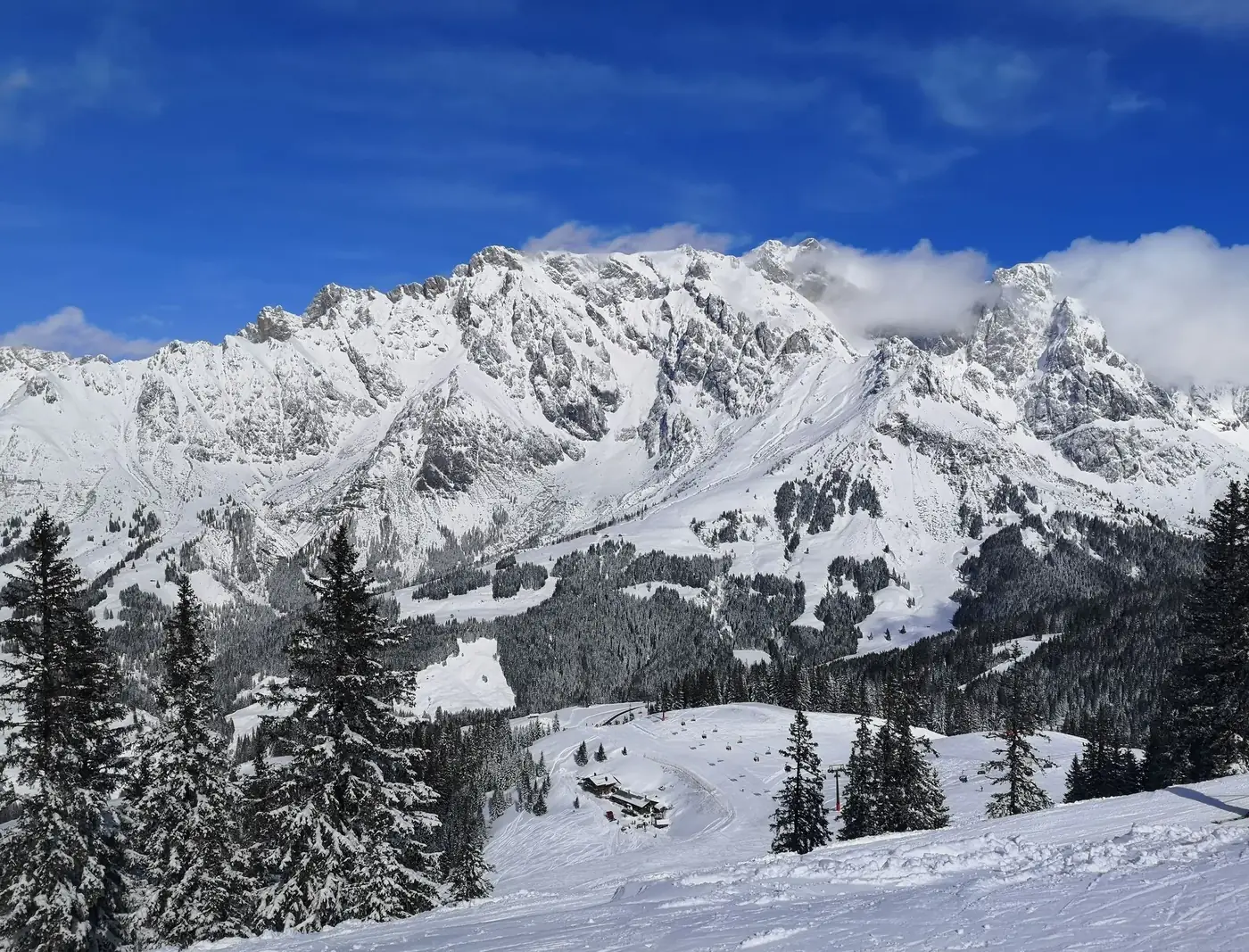 Stunning snowy alpine landscape of Hochkönig, Salzburg, Austria with clear blue skies.