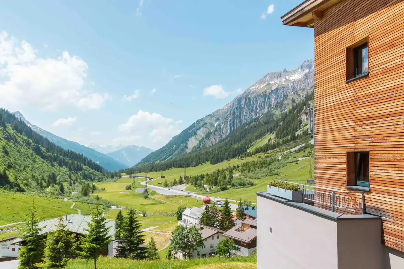 Breathtaking panoramic view of alpine valley from a hotel in Austria.