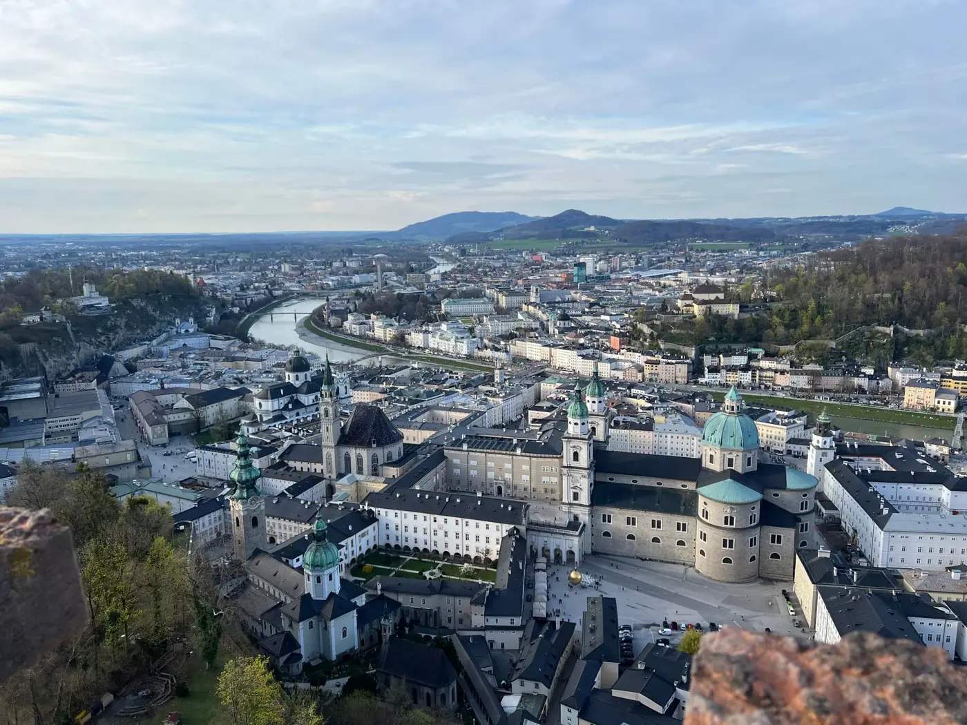 A breathtaking aerial shot showcasing Salzburg's historic architecture nestled along the Salzach River.