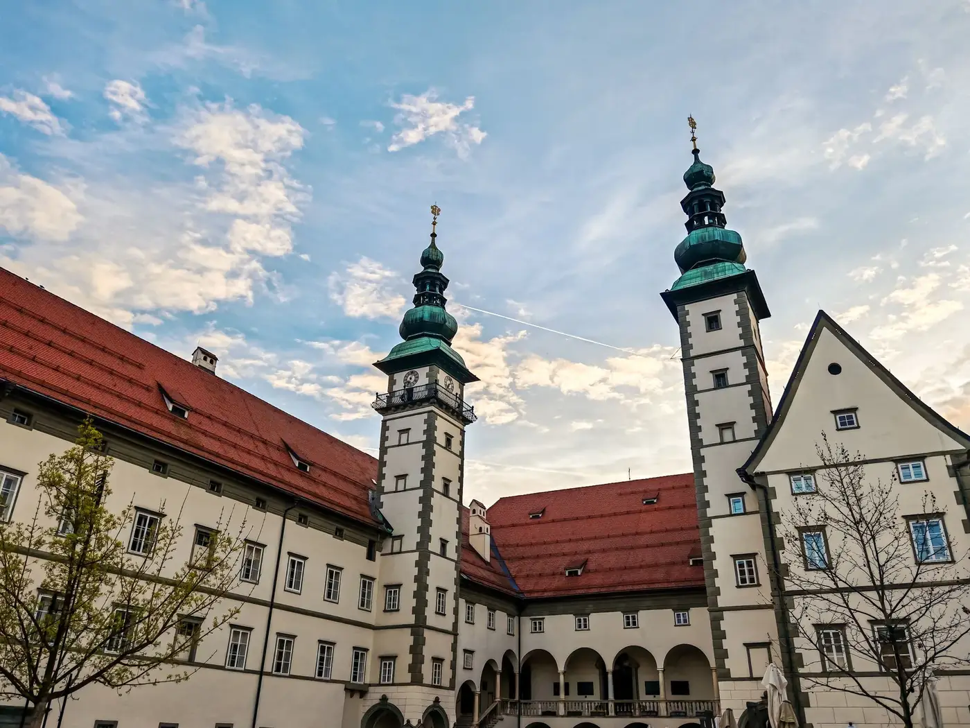 Historic European architecture featuring twin towers under a vibrant sky, perfect for travel themes.