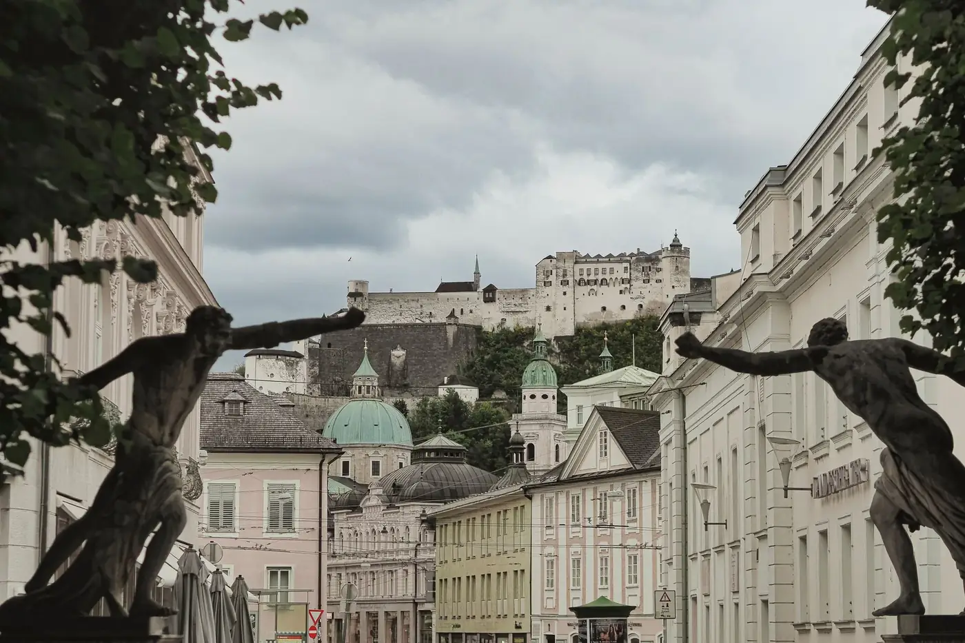 View of Salzburg's historic architecture with Hohensalzburg Fortress in the background.