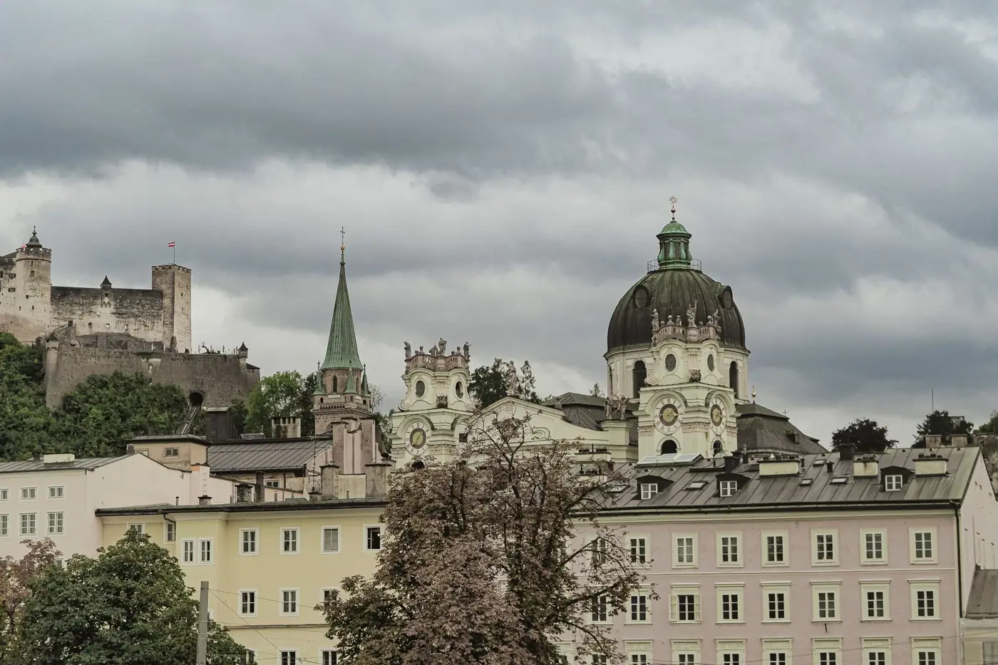 Explore the architectural charm of Salzburg's Dom Quartier with Hohensalzburg Fortress in the backdrop.